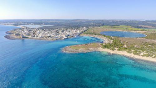 an aerial view of a group of islands in the water at Casa Tulipano 1 SX a soli 200 mt dal mare di Torre Colimena in Torre Colimena
