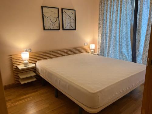 Ένα ή περισσότερα κρεβάτια σε δωμάτιο στο Apartamento Suite a pie de playa