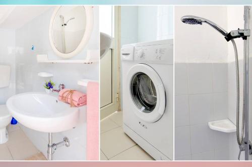 a bathroom with a washing machine and a sink at Casa Dino con accesso diretto alla Spiaggia di Punta Prosciutto in Punta Prosciutto