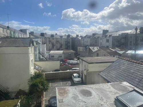 an overhead view of a city with buildings and cars at The Wildings Hotel & Tudno's Restaurant in Llandudno