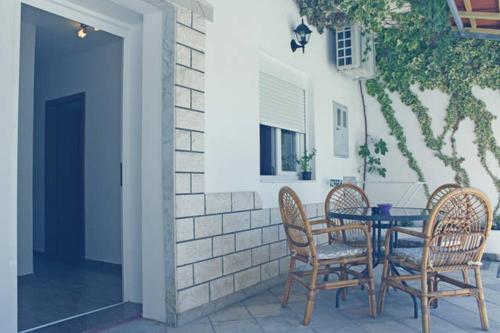 a table and chairs sitting on a patio at Laganini Apartments in Split