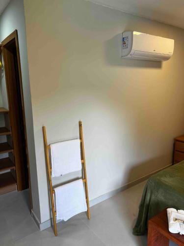 Ένα ή περισσότερα κρεβάτια σε δωμάτιο στο Recanto DomLuzia