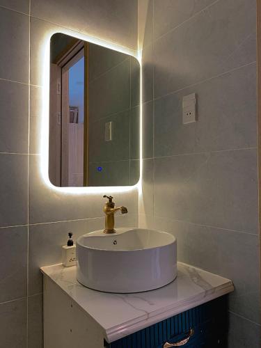 a bathroom with a sink and a mirror at Diamond Sea Hotel in Vung Tau