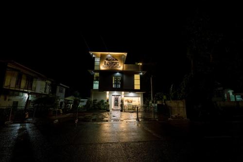 a lit up building in the dark at night at Loboc Riverside Inn & Restaurant in Loboc