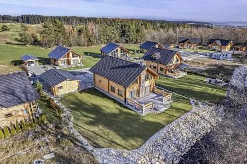 an aerial view of a large house with a yard at Chalet Severka in Veľká Lomnica