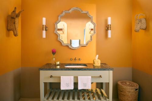 a bathroom with a sink and a mirror at 7 Koppies in Franschhoek