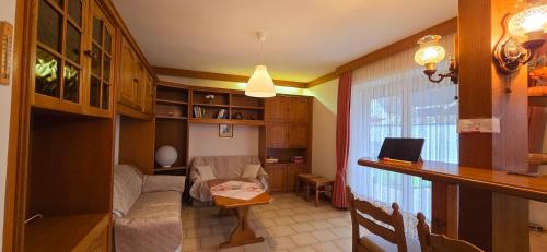 a small living room with a couch and a table at Apartment 9181 Feistritz in Rosental ,Klagenfurt in Feistritz im Rosental