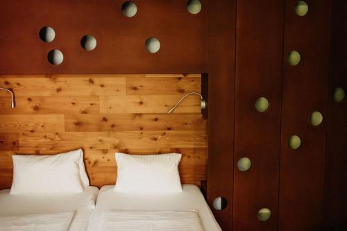 Ein Bett oder Betten in einem Zimmer der Unterkunft Hotel Hinteregger