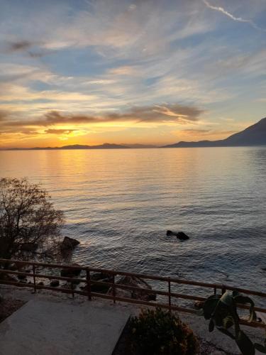 a sunset over a large body of water at Aegean Heaven in Samos