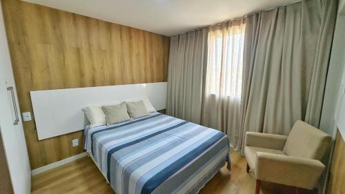 Ένα ή περισσότερα κρεβάτια σε δωμάτιο στο Paraíso das Águas