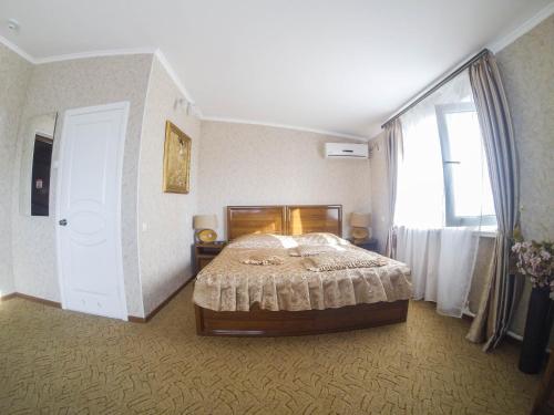 Postel nebo postele na pokoji v ubytování Galian Hotel