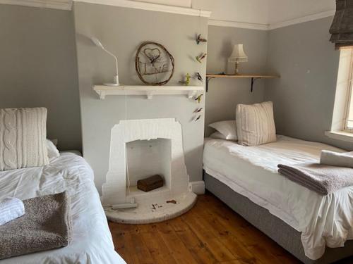 Ένα ή περισσότερα κρεβάτια σε δωμάτιο στο Sarah's Place- Heatherlands,George