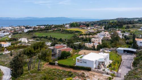 an aerial view of a small town with houses at Celeste Sea View Apartment Hot Tub 18 plus Adults only in Psalidi
