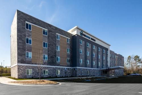 a rendering of the front of a hotel at Everhome Suites Rochester Greece in Rochester