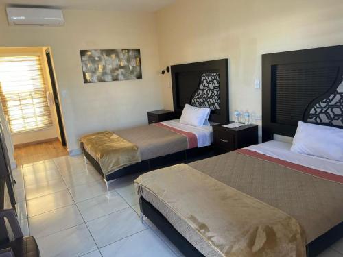 Postel nebo postele na pokoji v ubytování Hotel Vistas Juventud
