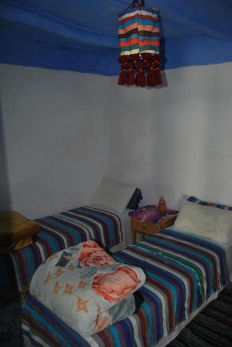 a room with two beds in a room at Ferme Dar Aicha green Bellouta in Bellouta