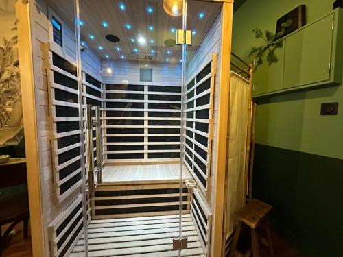a hallway with stairs in a room at LE JUNGLE-ROOM, Sauna, Hyper-centre in Mâcon