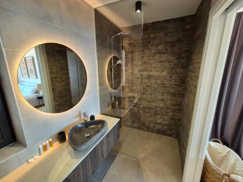 a bathroom with a sink and a mirror at Wild Adriatic Way in Zagorje
