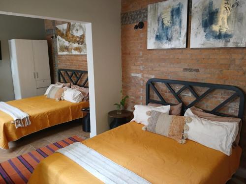Ένα ή περισσότερα κρεβάτια σε δωμάτιο στο Hotel Boutique Santa Elena