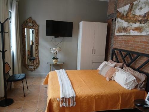 Ένα ή περισσότερα κρεβάτια σε δωμάτιο στο Hotel Boutique Santa Elena