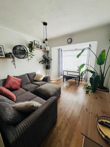 a living room with a couch and a table at The Annexe at Tenniside in Perranporth