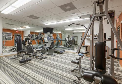 a gym with several treadmills and cardio machines at Candlewood Suites San Marcos by IHG in San Marcos