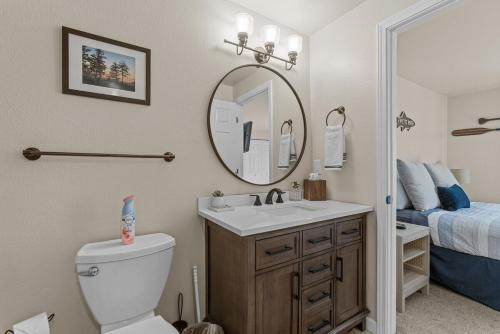 a bathroom with a sink and a toilet and a mirror at Idaho Treasure Hunt in Boise