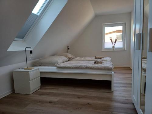 Postel nebo postele na pokoji v ubytování Ferienwohnung Leo