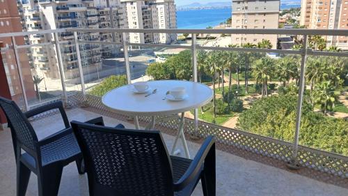 a table and chairs on a balcony with a view of the ocean at Capri 7 C Admer in San Blas