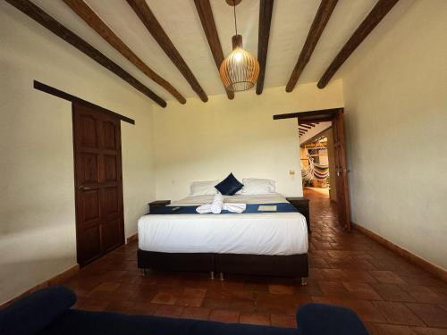 a bedroom with a bed in a room at Hotel Palais Barichara in Barichara