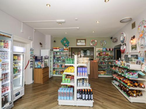 a store with a lot of products on display at 26 Manorcombe in Callington