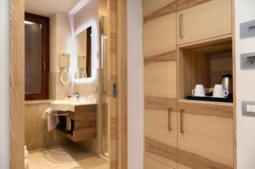 a bathroom with a sink and a mirror at Hotel Garden in Peschiera del Garda