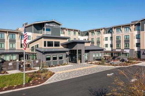 a building with an american flag in front of it at Residence Inn by Marriott Novato Sonoma in Novato