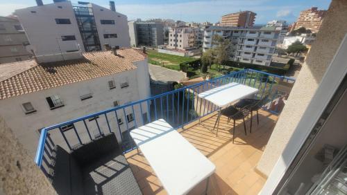 an apartment balcony with a view of a city at Appartement spacieux à 450 m de la plage in Roses