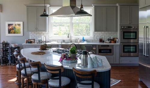 a kitchen with a large island in the middle at Glenn Meadow Bed and Breakfast in South Haven