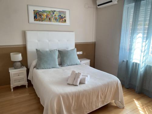 Ένα ή περισσότερα κρεβάτια σε δωμάτιο στο Casa Las Terrazas del Lago Alojamiento Rural