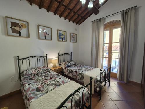 Postel nebo postele na pokoji v ubytování Casa Dery