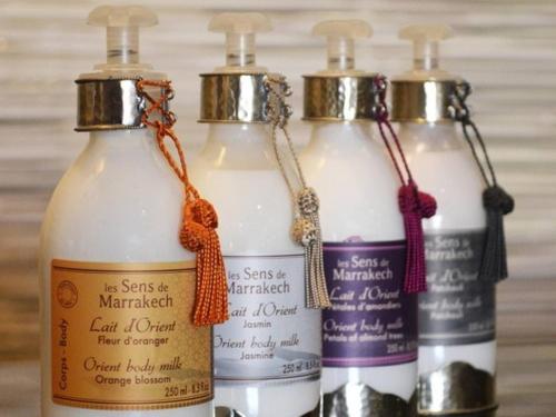 a group of three bottles of milk with bows at Lalla Ghita Appartement Essaouira Medina in Essaouira