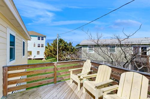 two chairs on the deck of a house at Sea View 44 in Avon
