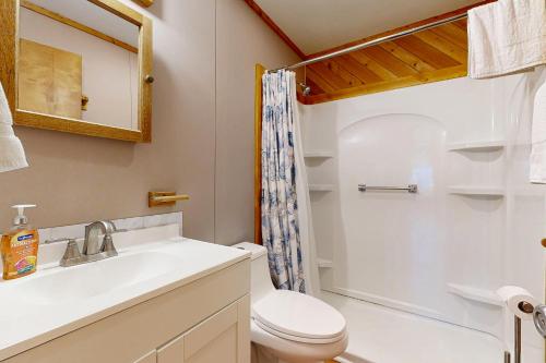 a bathroom with a sink and a toilet and a shower at Sea View 44 in Avon