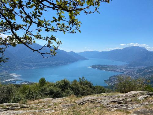 a view of a lake from a mountain at Casa Ai Lupi with Panoramic view in Gordola