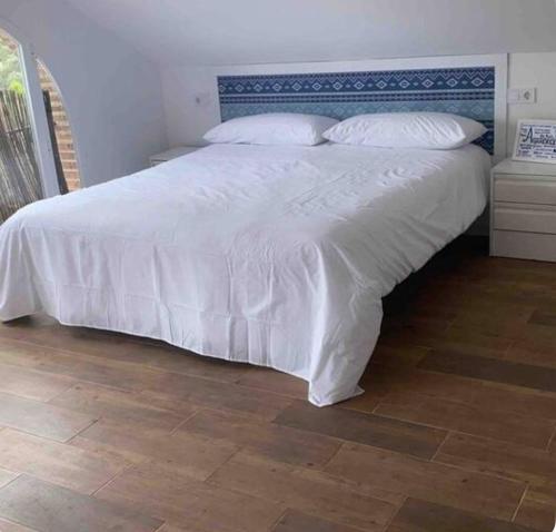 En eller flere senge i et værelse på Villa Altavista Toledo