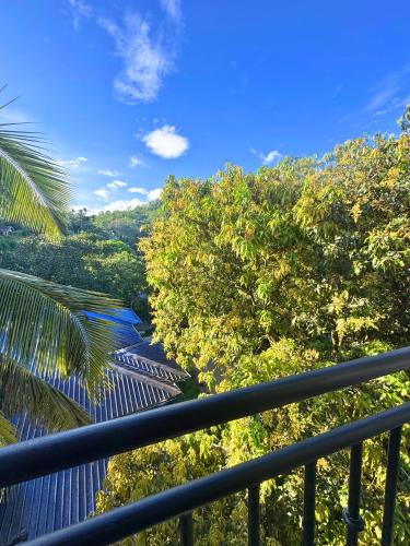 a view of a river from a balcony at Queens mount in Kandy