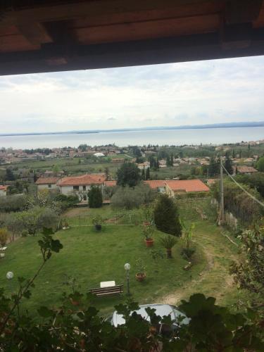 a view of a garden with a view of the ocean at CA' BELLAVISTA in Bardolino
