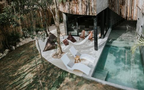 an overhead view of a hammock and a swimming pool at Media Luna BoHo Chic Villa E11 Pvt Pool Concierge in Tulum