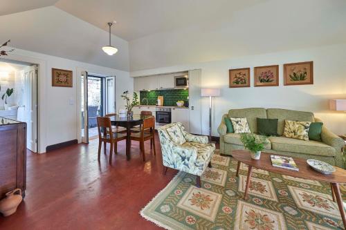 a living room with a couch and a table at Bordal Houses in Funchal