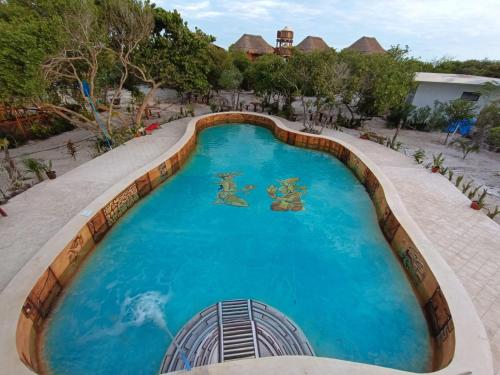 an overhead view of a swimming pool at a resort at Experiencia Casa Blanca in Dzilam de Bravo
