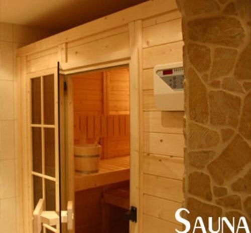 a door leading into a kitchen with a stove at Pension Altenbeck & Ferienwohnung in Winterberg