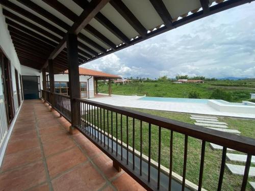 a balcony of a house with a view at U-GO Casa Toledo Quindío in Montenegro