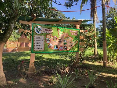 a sign in a park in the grass at Susurro de estrellas in La Esperanza